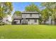 Exterior view of a home with a spacious, green backyard at 4736 Rocky Knob Ln, Indianapolis, IN 46254