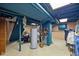 Image of the basement including a water heater, storage and unfinished ceiling with industrial lighting at 4736 Rocky Knob Ln, Indianapolis, IN 46254