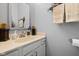 Bathroom featuring a single sink vanity with white cabinetry, a framed mirror, and neutral wall color at 4736 Rocky Knob Ln, Indianapolis, IN 46254