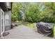 Outdoor deck area with dark wood finish, furniture and grill at 4736 Rocky Knob Ln, Indianapolis, IN 46254
