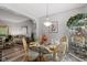 Cozy dining room with a glass table, ornate chairs, and natural light at 4736 Rocky Knob Ln, Indianapolis, IN 46254