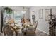 Cozy dining room with a glass table, ornate chairs, and natural light at 4736 Rocky Knob Ln, Indianapolis, IN 46254