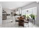 Kitchen with a dining area with views from an abundance of plants through the large bay window at 4736 Rocky Knob Ln, Indianapolis, IN 46254