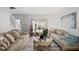 Elegant living room featuring stylish furniture, decor, and wood-look flooring at 4736 Rocky Knob Ln, Indianapolis, IN 46254