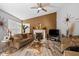 Cozy living room with a fireplace, stylish decor, hardwood floors, and neutral wall colors at 4736 Rocky Knob Ln, Indianapolis, IN 46254