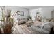 Elegant living room featuring stylish furniture, decor, and wood-look flooring at 4736 Rocky Knob Ln, Indianapolis, IN 46254