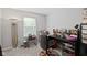 This is a carpeted room with a desk and chair near the window at 4736 Rocky Knob Ln, Indianapolis, IN 46254