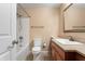 Bathroom featuring a vanity with granite countertops, modern fixtures, and a shower-tub combo at 4904 N Tillotson Ave, Muncie, IN 47304