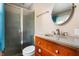 Bathroom featuring a vanity with granite countertops, modern fixtures, and glass-enclosed shower at 4904 N Tillotson Ave, Muncie, IN 47304