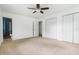 Bright bedroom with neutral carpet and large closets for storage at 4904 N Tillotson Ave, Muncie, IN 47304