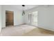 Dining area features modern lighting and sliding glass door to backyard patio at 4904 N Tillotson Ave, Muncie, IN 47304