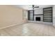 Bright living room featuring a decorative fireplace and built-in bookshelves at 4904 N Tillotson Ave, Muncie, IN 47304