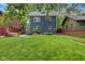 Expansive backyard with a patio, lawn, landscaping, providing an ideal outdoor retreat at 519 Woodruff Place Middle Dr, Indianapolis, IN 46201