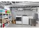 Basement laundry area with new washer/dryer hookups and shelving at 519 Woodruff Place Middle Dr, Indianapolis, IN 46201