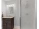 Bathroom featuring a granite countertop vanity and glass shower at 519 Woodruff Place Middle Dr, Indianapolis, IN 46201