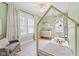 Charming bedroom with a play tent bed, ceiling fan, and lots of natural light from the windows at 519 Woodruff Place Middle Dr, Indianapolis, IN 46201