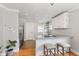 Bright kitchen featuring granite countertops, stainless steel appliances, and a breakfast bar with seating at 519 Woodruff Place Middle Dr, Indianapolis, IN 46201