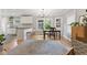 Bright, eat-in kitchen with white cabinets, granite countertops, and hardwood floors at 519 Woodruff Place Middle Dr, Indianapolis, IN 46201