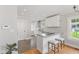 Modern kitchen featuring granite countertops, white cabinets, and stainless steel appliances at 519 Woodruff Place Middle Dr, Indianapolis, IN 46201