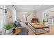 Bright living room features hardwood floors, a comfortable sofa, and stylish decor at 519 Woodruff Place Middle Dr, Indianapolis, IN 46201