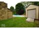 The backyard area includes a pool and storage shed, offering both recreation and utility in a well-maintained space at 5331 Birch Ln, Greenwood, IN 46143