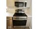 Modern stainless steel appliances including a range, microwave, and dishwasher at 5331 Birch Ln, Greenwood, IN 46143