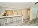 Open-concept kitchen featuring a breakfast bar, new appliances and updated flooring at 5331 Birch Ln, Greenwood, IN 46143