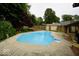 Large backyard pool with a deck, privacy fence, and storage shed at 5331 Birch Ln, Greenwood, IN 46143