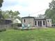 Charming backyard view with a patio, lush lawn, and well-maintained exterior at 5348 Crittenden Ave, Indianapolis, IN 46220