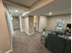 Finished basement area featuring a partial view of a living room, an open door to a bedroom at 5348 Crittenden Ave, Indianapolis, IN 46220