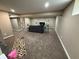 Finished basement featuring carpeted floor and modern decor with taupe walls at 5348 Crittenden Ave, Indianapolis, IN 46220