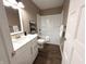 Well lit bathroom featuring a shower and bathtub, with modern sink and faucet at 5348 Crittenden Ave, Indianapolis, IN 46220