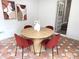 Breakfast nook with a wooden table, red chairs, and decorative tile floor at 5348 Crittenden Ave, Indianapolis, IN 46220