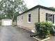 Side view of the home with a detached garage at 5348 Crittenden Ave, Indianapolis, IN 46220