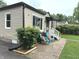Exterior featuring tidy landscaping and detached garage at 5348 Crittenden Ave, Indianapolis, IN 46220