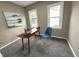 Home office with desk, chair, and natural light at 5348 Crittenden Ave, Indianapolis, IN 46220