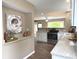 Open kitchen with stainless steel appliances, granite countertops, and hardwood floors at 5348 Crittenden Ave, Indianapolis, IN 46220