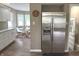 Bright kitchen featuring white cabinets, modern appliances, and a dining nook at 5348 Crittenden Ave, Indianapolis, IN 46220
