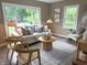 Bright living room with large windows, stylish furniture, and a comfortable seating area at 5348 Crittenden Ave, Indianapolis, IN 46220