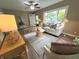 Inviting living room with a ceiling fan, ample seating, and natural light at 5348 Crittenden Ave, Indianapolis, IN 46220