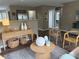 Spacious living area with stylish decor, wood floors, and an open layout at 5348 Crittenden Ave, Indianapolis, IN 46220