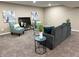 Basement living room with couch, two chairs and side tables with contemporary decor at 5348 Crittenden Ave, Indianapolis, IN 46220