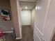 Small storage room with white walls and carpet, accessible through an open doorway at 5348 Crittenden Ave, Indianapolis, IN 46220