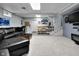 The finished basement offers a stylish seating area with a leather sectional and a modern design at 5543 N Pennsylvania N St, Indianapolis, IN 46220