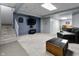 The spacious finished basement features a entertainment area with a TV and comfortable seating at 5543 N Pennsylvania N St, Indianapolis, IN 46220
