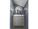 This stylish bathroom features a round mirror and a modern vanity with a sleek design at 5543 N Pennsylvania N St, Indianapolis, IN 46220
