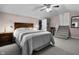 This cozy bedroom offers comfort with an inviting bed, soft colors, and access to additional spaces at 5543 N Pennsylvania N St, Indianapolis, IN 46220