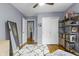 This bedroom features hardwood floors, closet, and a mirror at 5543 N Pennsylvania N St, Indianapolis, IN 46220