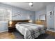 This bedroom features a window, queen bed, and a dresser at 5543 N Pennsylvania N St, Indianapolis, IN 46220