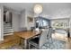 Inviting dining area with wood table, stylish chairs, and view to living room at 5543 N Pennsylvania N St, Indianapolis, IN 46220